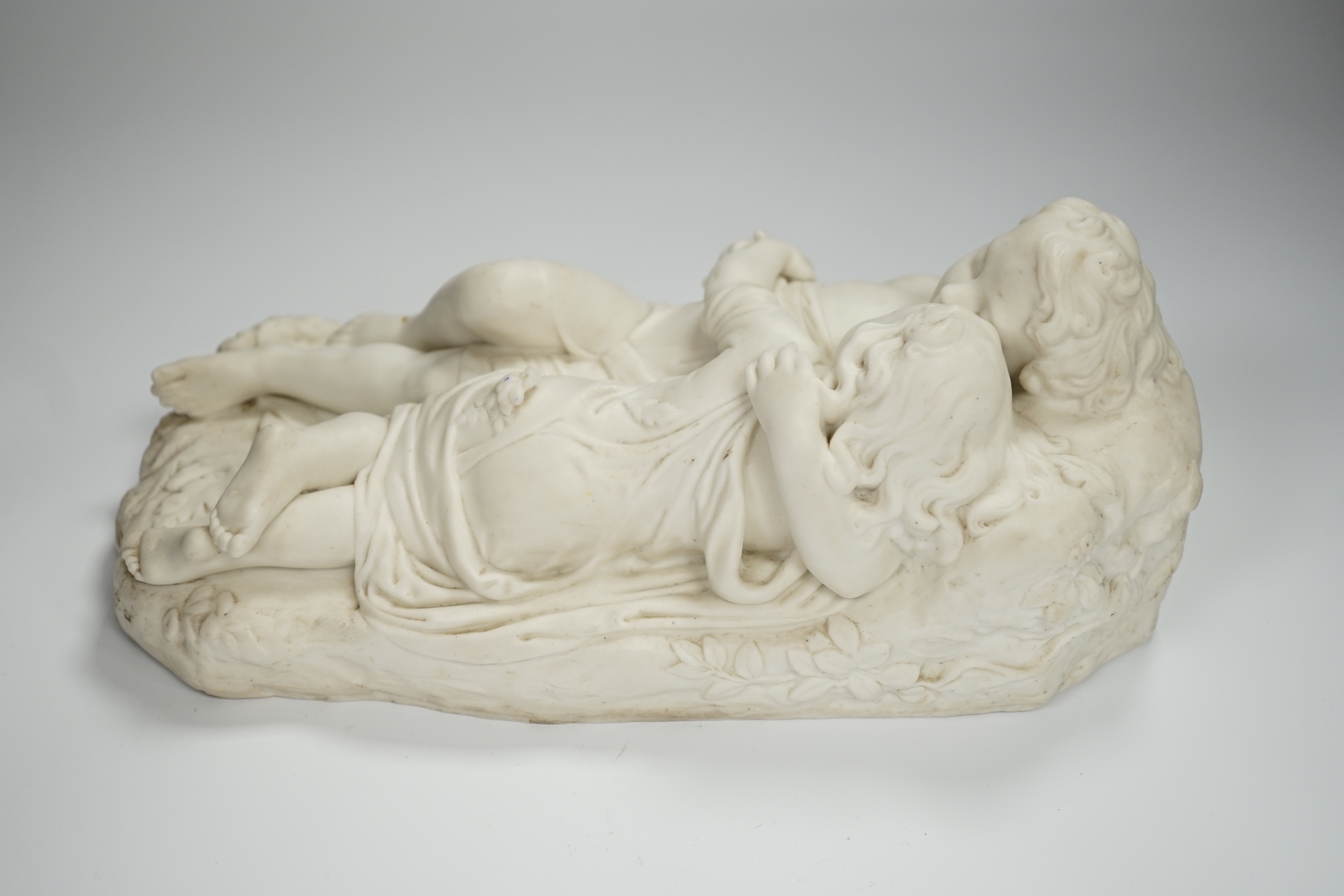 After John Bell, a Victorian parian reclining figure of a mother and child, 30cms wide